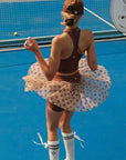 Brown zip-front tennis tank with a collar and subtle logo, offering a chic look for on-court wear.