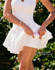 The white Spin™ Rose Petal Skir features two-way pockets on both sides inside for storage.