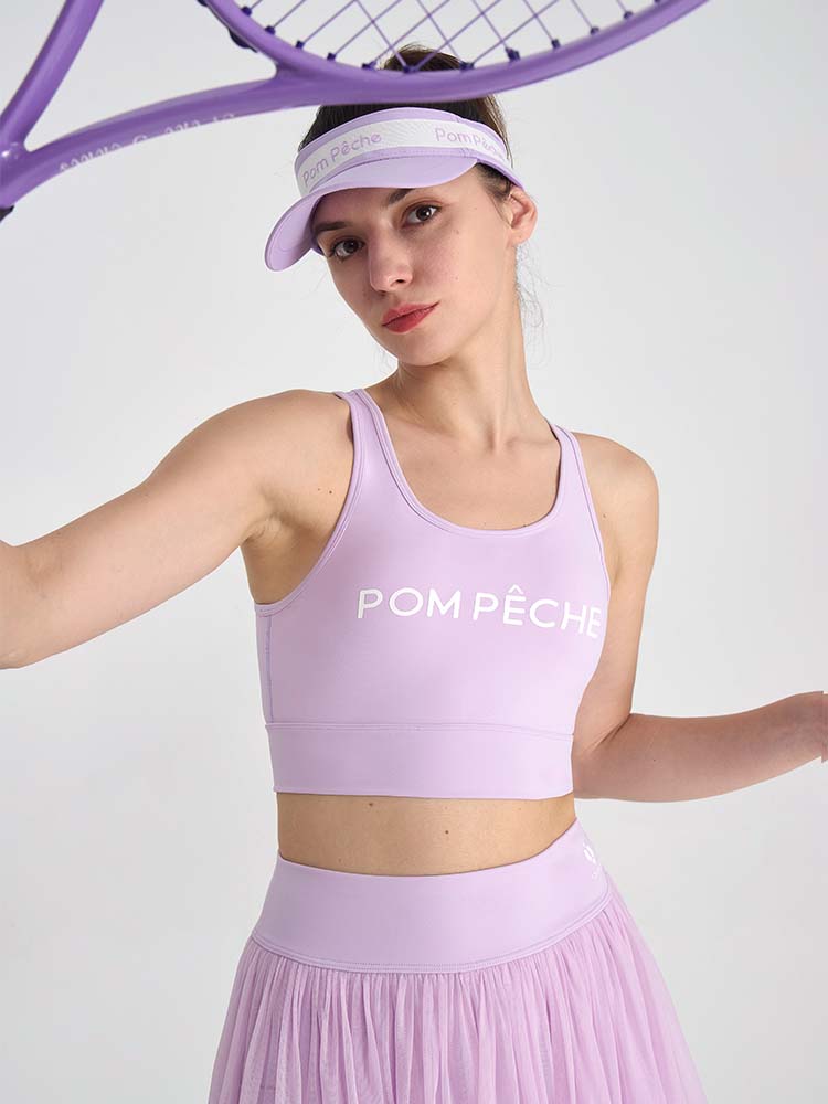 Light purple sports bra with brand logo, designed for comfort and style during active sports.