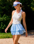 Betty Boop Cake Skirt Paris Blue in a lifestyle scene, showcasing youthful tennis style, energetic feminine outfit, and flowy tiered ruffle mesh design