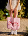Oversized Court Tote Bag front view, showcasing full canvas tote design, adjustable shoulder strap length, spacious tennis bag silhouette, and French-inspired illustration