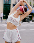 Poise Mesh Back Tank Top White fabric detail, featuring soft LYCRA stretch fabric, built-in padded bra support, breathable comfort, and flexible tennis wear