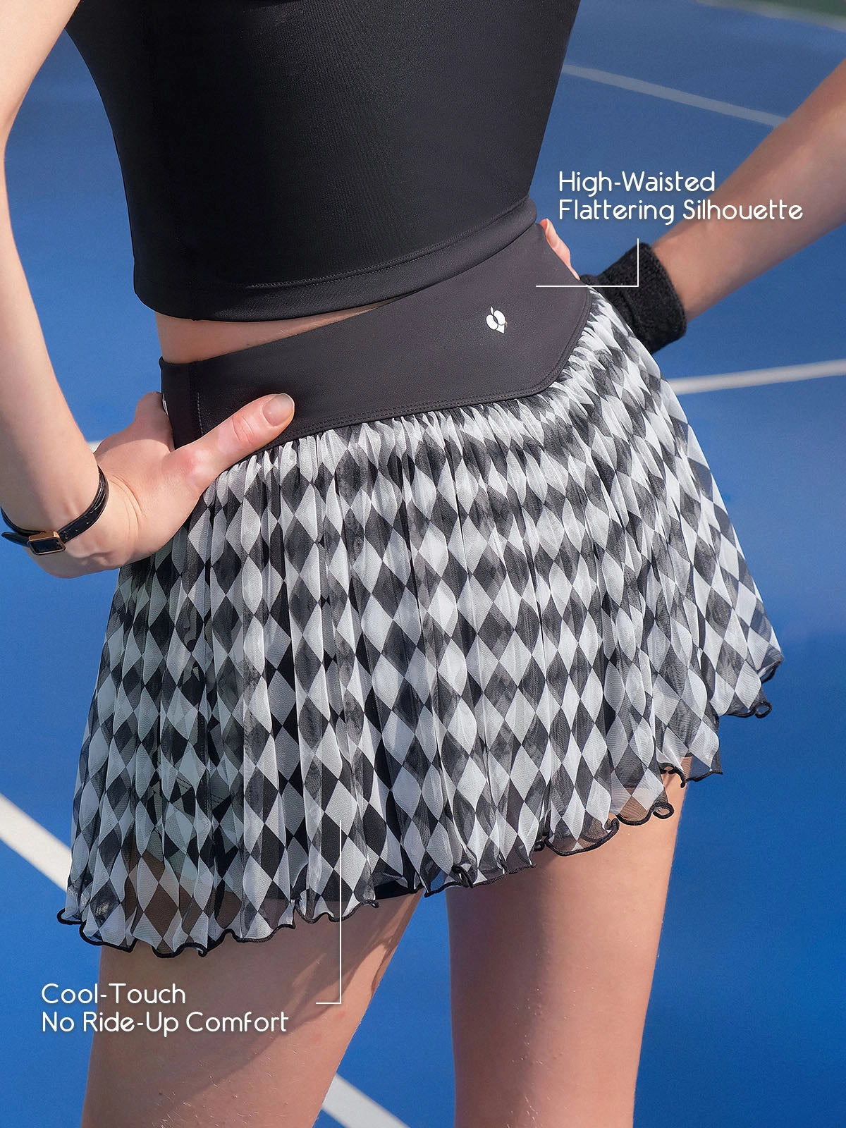 Spin™ Diamond Mesh Tennis Skirt back view, featuring a flattering high-waisted fit and flowing layered mesh design