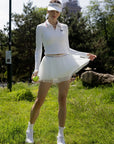 Spin Layered Mesh Pleated Tennis Skirt White, double layer pleated mesh tennis skort with built-in shorts, elegant movement, and sporty feminine style