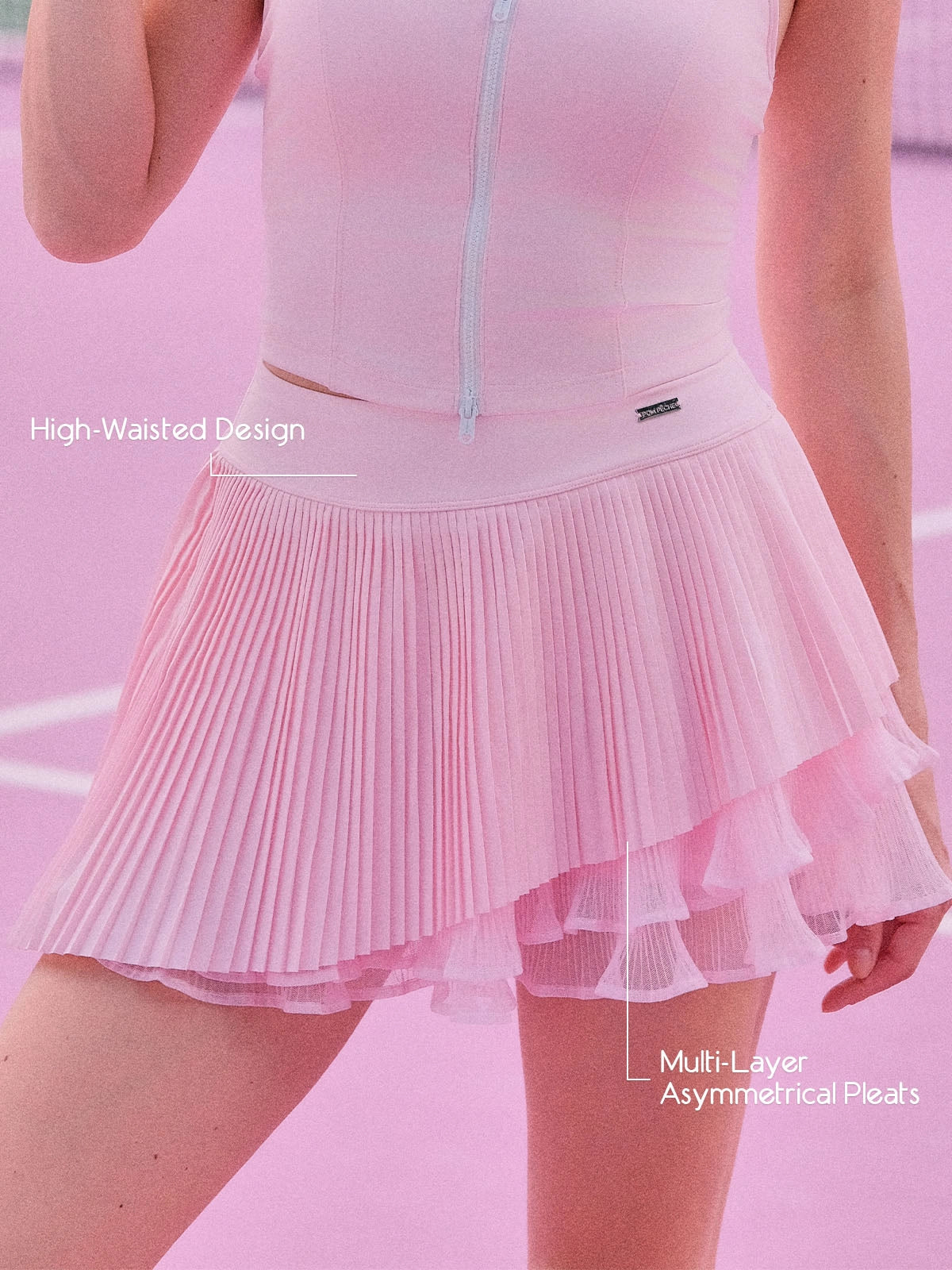 Spin™ Waltz Layered Skirt featuring multi-layer asymmetric pleats, sculpting waistband, and flexible tennis-ready design