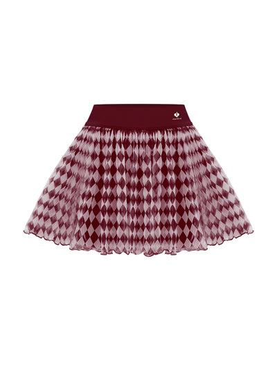 A flat lay of a red argyle mesh tennis skirt featuring a lightweight pleated mesh overlay and wide waistband, shown against a clean white background