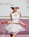 Model posing in Betty Boop Bow Halter Tennis Top - Paris White
