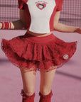 Person wearing a red and white outfit with a heart design on a pink background