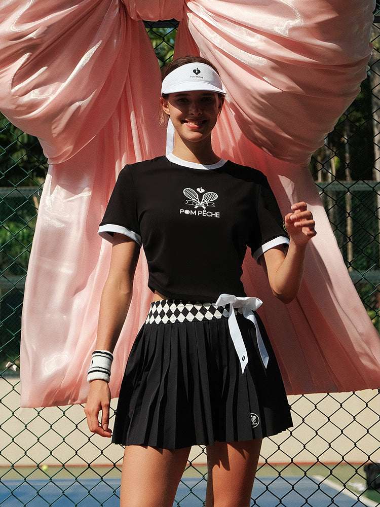 Black cropped graphic tennis tee with a printed design, offering a lightweight, breathable feel for warm-weather play.