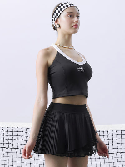 Black cropped tank top with contrast trim, bow detail, and printed logo for a sleek, sporty look.