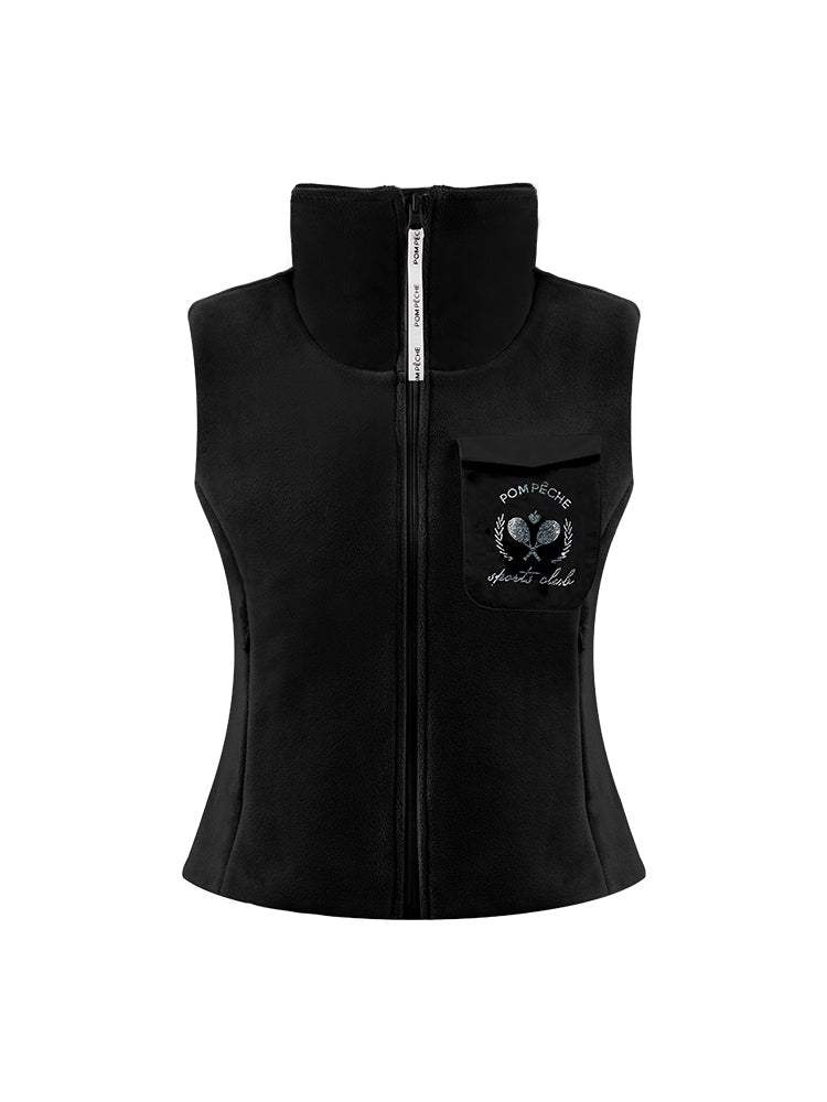Warm black fleece vest with high-neck zip design and embroidered chest pocket, styled on the tennis court.