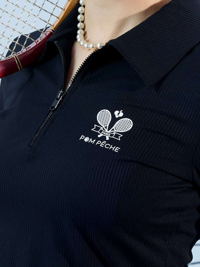 Black long-sleeve zip-collar polo top with a subtle printed logo, featuring a fitted silhouette for a sleek, sporty look.