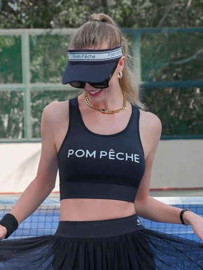 Black tennis visor with a Pom Pêche logo on the band.