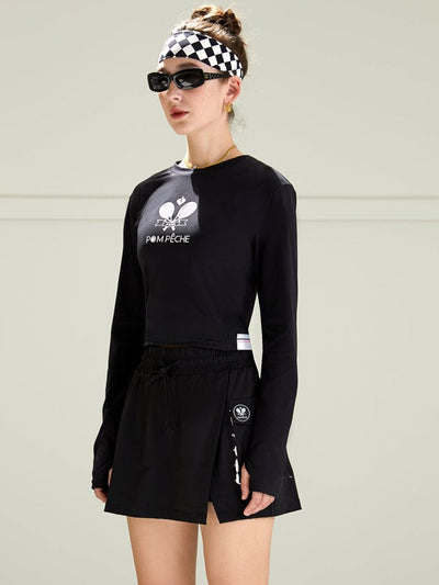 Black cropped long-sleeve tee with a round neckline, featuring printed logo in the center. 