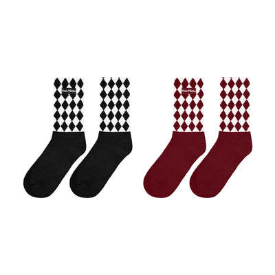 Set of black and red mid-crew socks with checkered pattern and Pom Pêche logo.