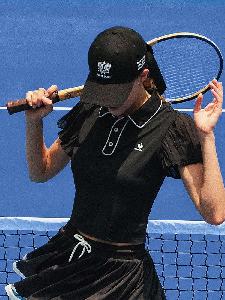 Black tennis baseball cap with embroidered Pom Pêche logo and detachable ribbon.