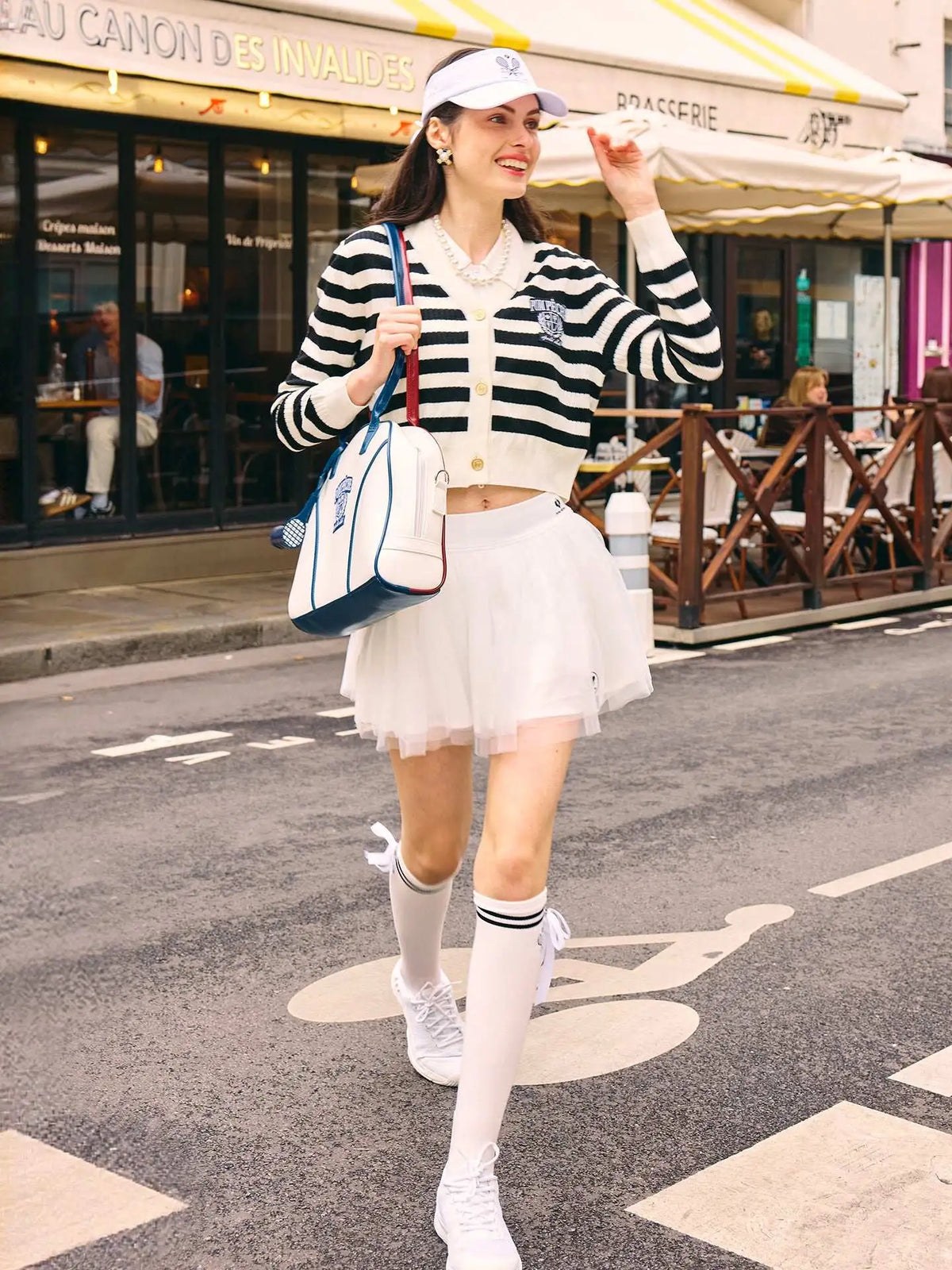 Model walking the street in casual outfit. 