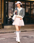 Model walking the street in casual outfit. 