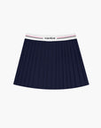  A navy pleated tennis skirt is displayed in a modern athletic outfit suitable for tennis or fitnes