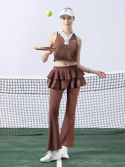 Brown cropped tennis top with ruffled collar and sleeveless design, featuring a subtle logo for a chic, sporty look.
