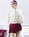 Cream fleece zip-up jacket with a soft texture and subtle logo detail, offering a polished yet cozy look.