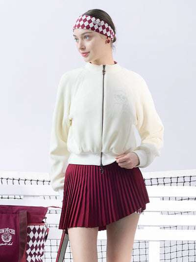 Cream fleece zip-up jacket with a soft texture and subtle logo detail, offering a polished yet cozy look.