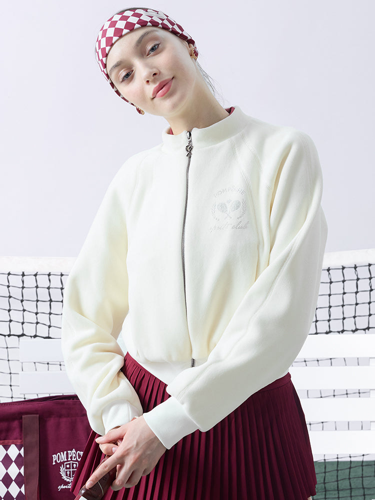 Cream fleece zip-up jacket with a soft texture and subtle logo detail, offering a polished yet cozy look.