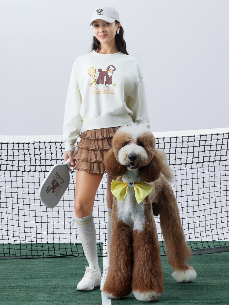 Soft, casual sweatshirt featuring a playful dog-and-tennis graphic, perfect for relaxed, sporty looks.