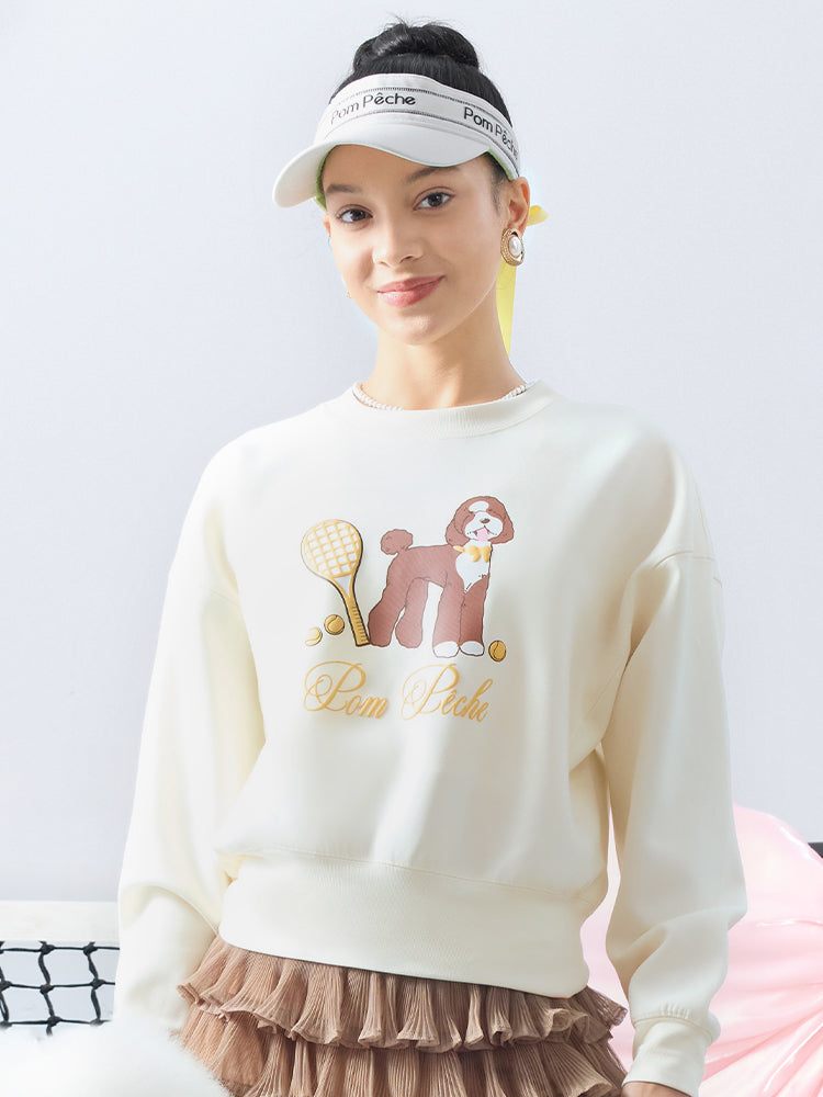 Soft, casual sweatshirt featuring a playful dog-and-tennis graphic, perfect for relaxed, sporty looks.