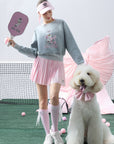Soft, casual gray sweatshirt featuring a playful dog-and-tennis graphic, perfect for relaxed, sporty looks.