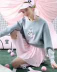 Soft, casual sweatshirt featuring a playful dog-and-tennis graphic, perfect for relaxed, sporty looks.