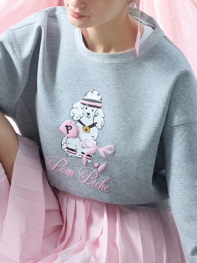 Soft, casual sweatshirt featuring a playful dog-and-tennis graphic, perfect for relaxed, sporty looks.