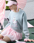 Soft, casual sweatshirt featuring a playful dog-and-tennis graphic, perfect for relaxed, sporty looks.