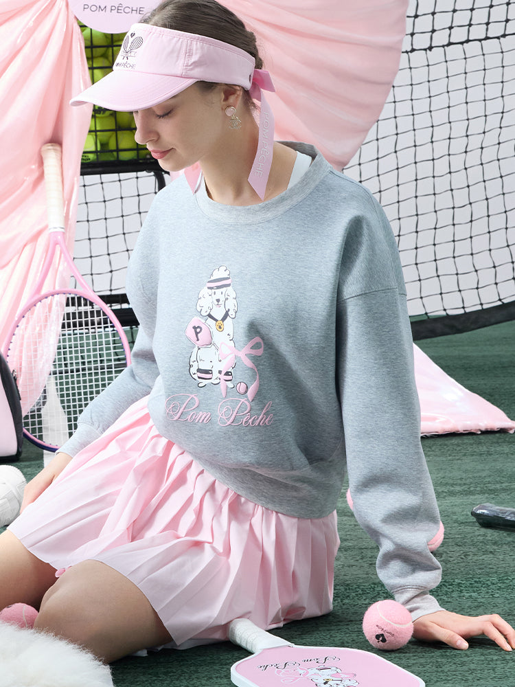 Soft, casual sweatshirt featuring a playful dog-and-tennis graphic, perfect for relaxed, sporty looks.