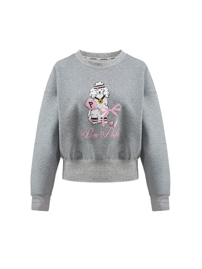 Soft, casual sweatshirt featuring a playful dog-and-tennis graphic, perfect for relaxed, sporty looks.