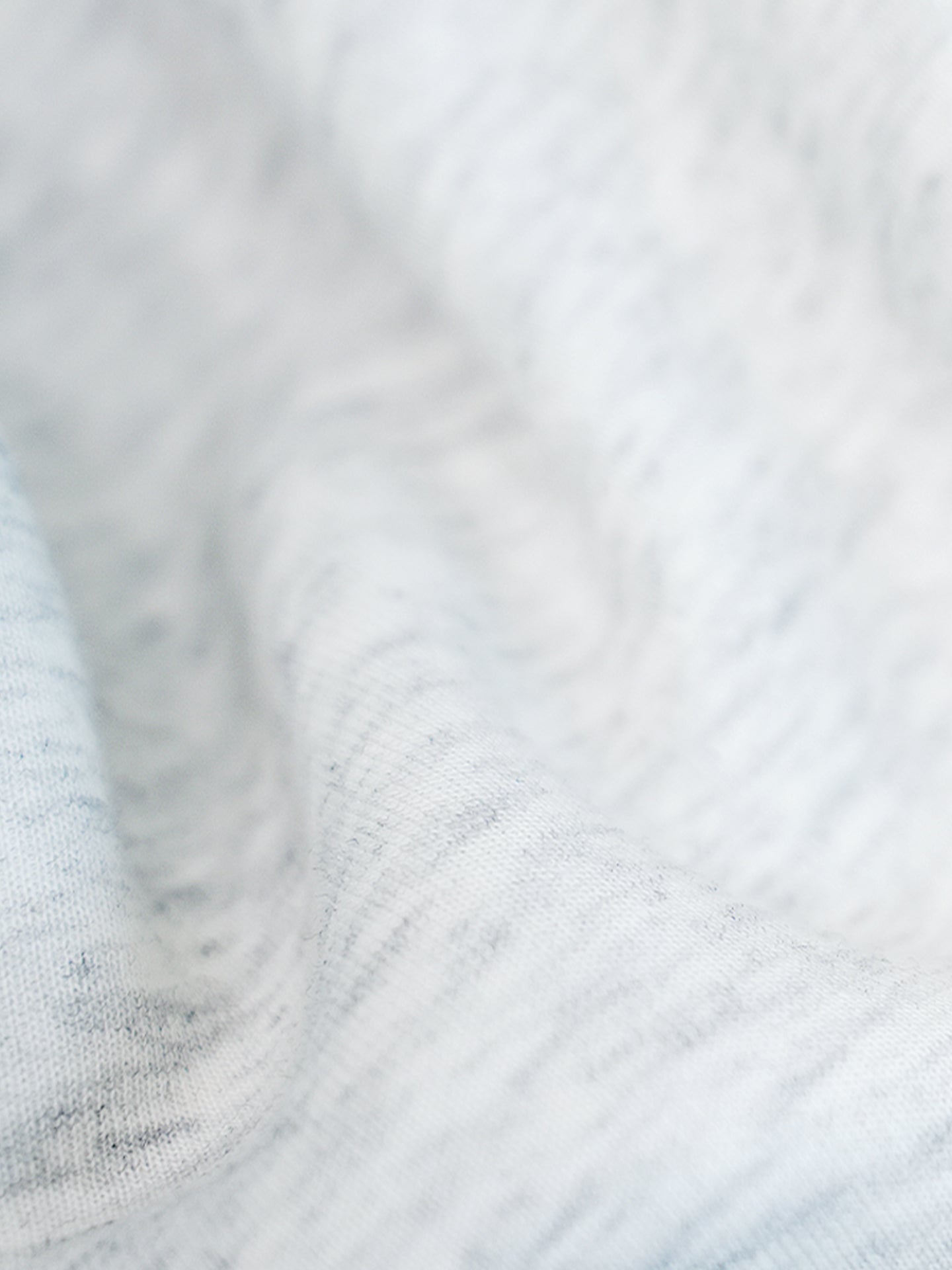 Close-up of the soft grey sweatshirt fabric.