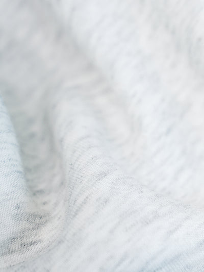 Close-up of the soft grey sweatshirt fabric.