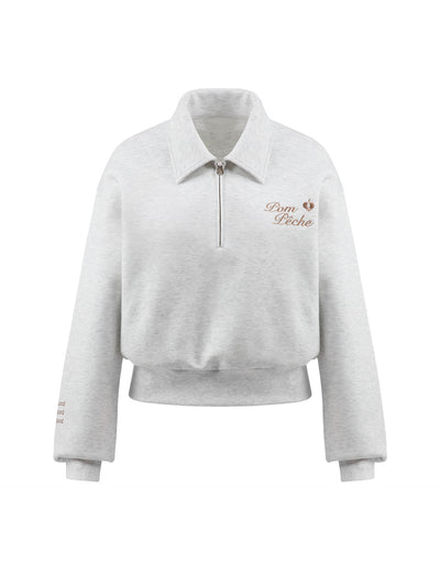 Gray sweatshirt with quarter-zip design and embroidered logo.