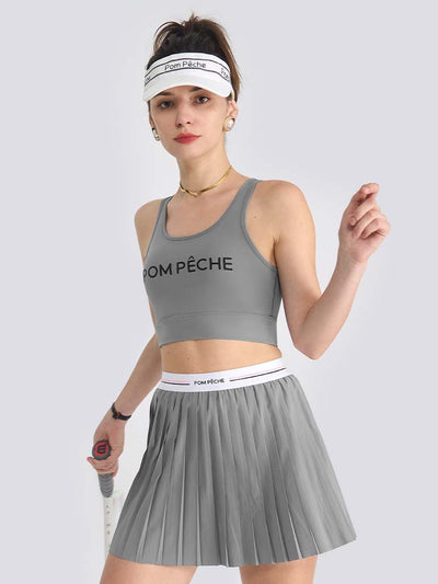 Gray sports bra with brand logo, designed for comfort and style during active sports.