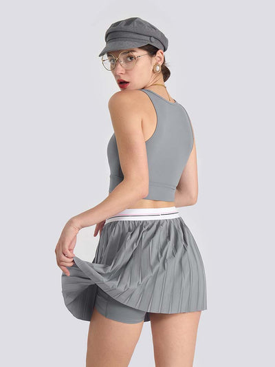 Gray sports bra with brand logo, designed for comfort and style during active sports.