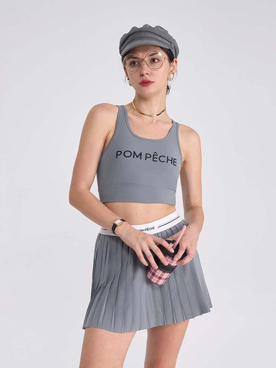 Gray sports bra with brand logo, designed for comfort and style during active sports.