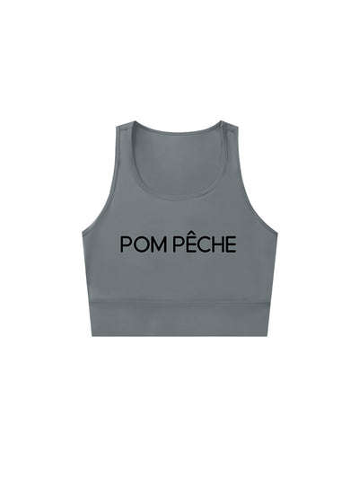 Gray sports bra with brand logo, designed for comfort and style during active sports.