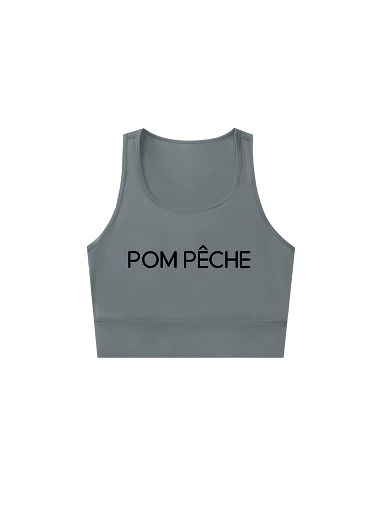 Gray sports bra with brand logo, designed for comfort and style during active sports.