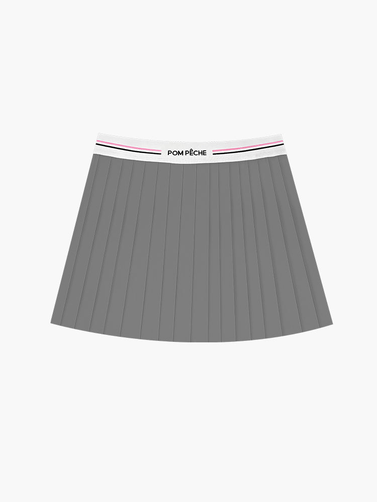 A sporty grey pleated tennis skirt for women, showcasing a classic fit with flowing pleats suitable for tennis, golf, and daily workouts.