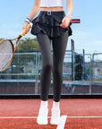Grey tennis leggings with a tiered ruffle skirt and high waist, stretchy fabric for comfort and active movement .