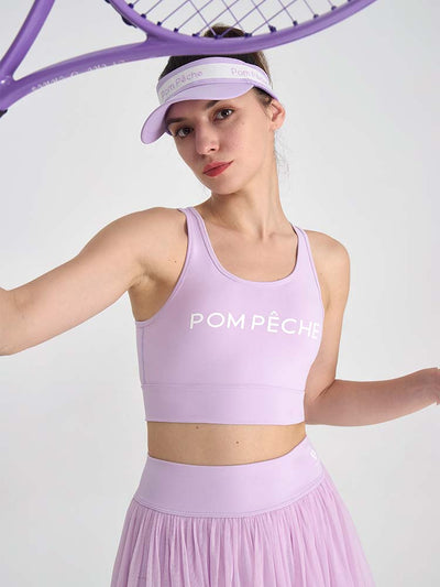 Light purple sports bra with brand logo, designed for comfort and style during active sports.