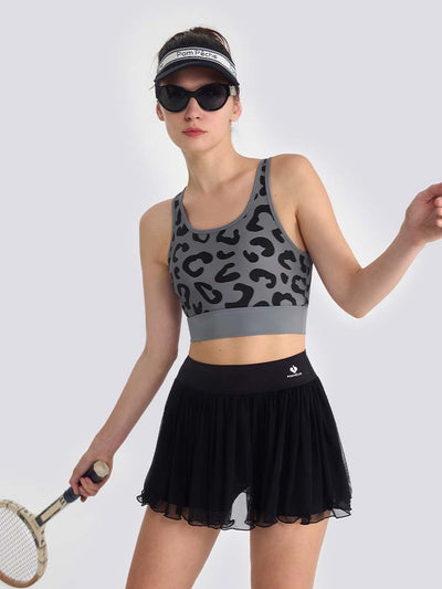 Gray sports bra with printed leopard pattern, designed for comfort and style during active sports.