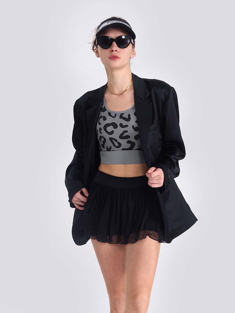 Gray sports bra with printed leopard pattern, designed for comfort and style during active sports.