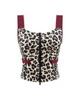 Leopard print sports tank with contrast straps and a zip front. Fitted, chic, and perfect for elevating on-court look.