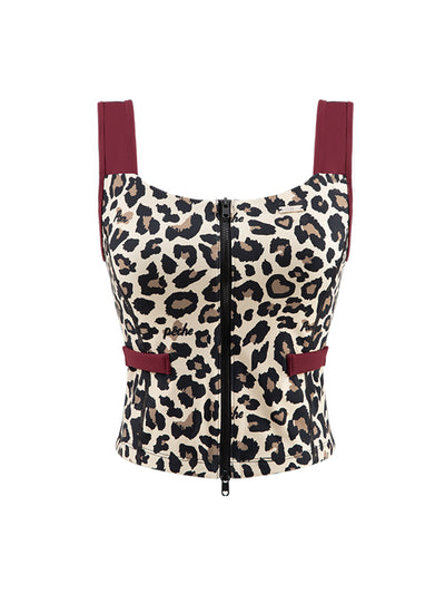 Leopard print sports tank with contrast straps and a zip front. Fitted, chic, and perfect for elevating on-court look.